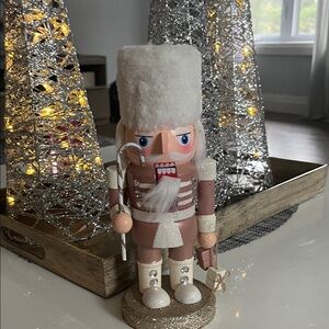 Elegant Nutcracker with White Hat and Brown Uniform
